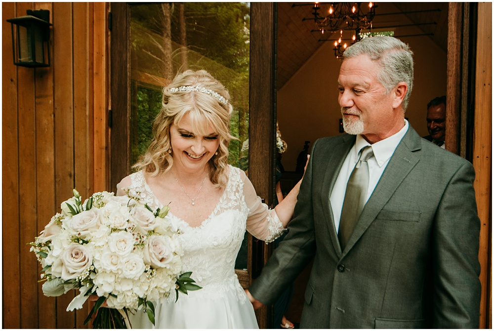 flowery branch wedding photographer takes pictures of the wedding ceremony at Juliette Chapel, a wedding venue in Dahlonega, Ga, hidden wooded wedding venue 