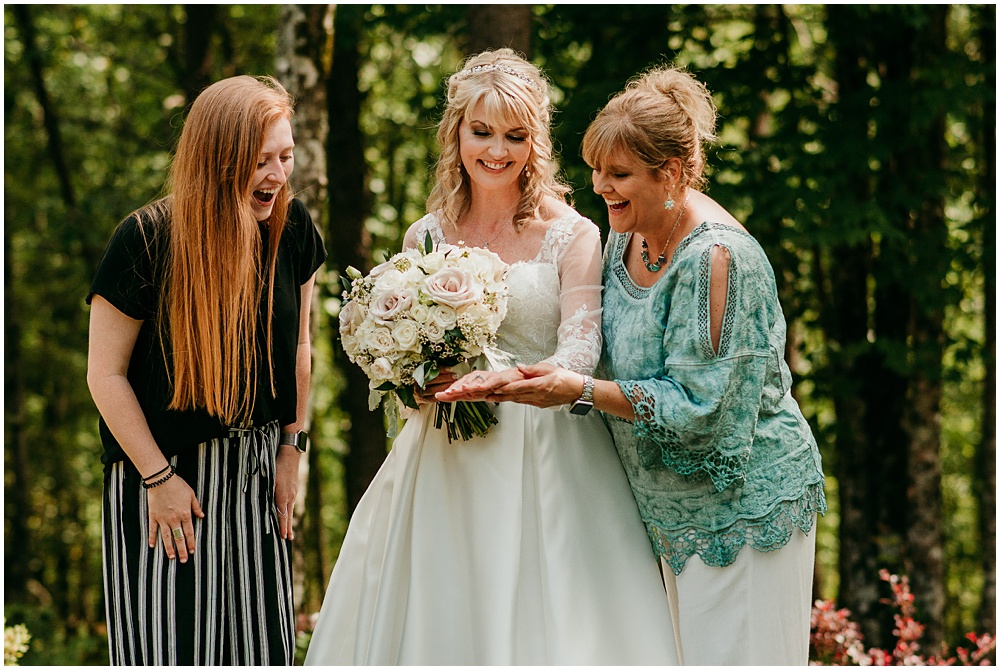 flowery branch wedding photographer takes pictures of the Bride and her friends at Juliette Chapel, a wedding venue in Dahlonega, Ga, hidden wooded wedding venue 