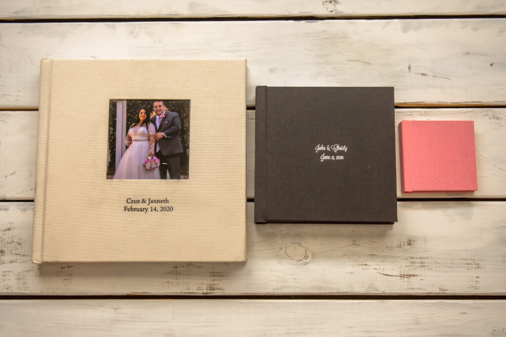 Atlanta wedding photographer displays different album sizes and why it's important to invest in an album. 