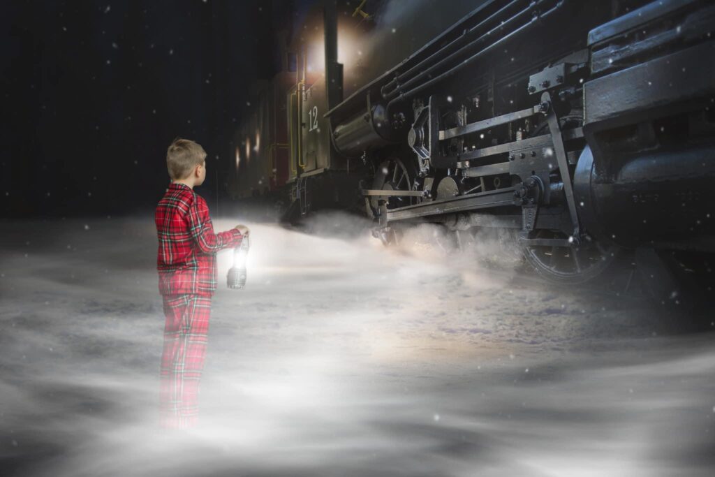 composite of boy beside train for polar express mini session 