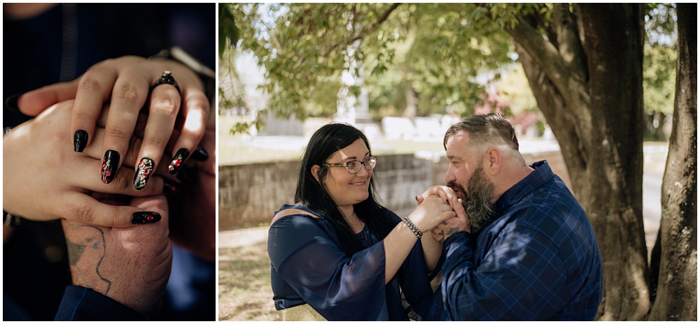 Groom kisses Bride's hand during an engagement session at Oakland Cemetery in Atlanta georgia. Goth bride 2025