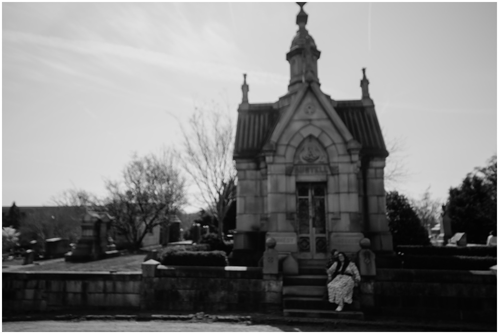 Bride & Groom posing on steps during an engagement session at Oakland Cemetery in Atlanta georgia. Goth bride 2025