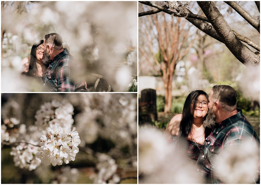 white blooms on a tree during an engagement session at Oakland Cemetery in Atlanta georgia. Goth bride 2025