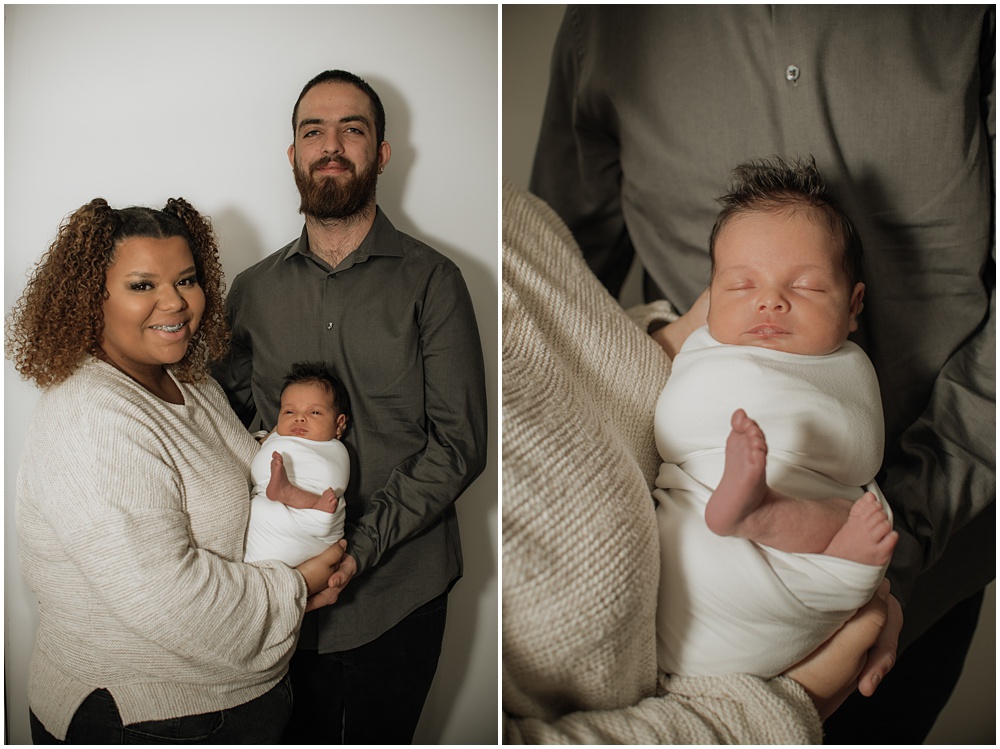 Flowery Branch photographer takes a group photo of the baby and his parents during the newborn session in the studio. Everyone is all smiles.