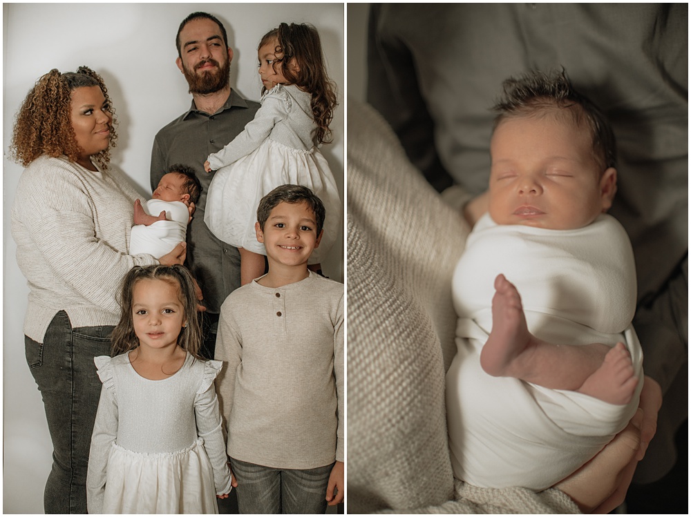 Flowery Branch photographer takes a group photo of the baby and his family during the newborn session in the studio. Everyone is all smiles.