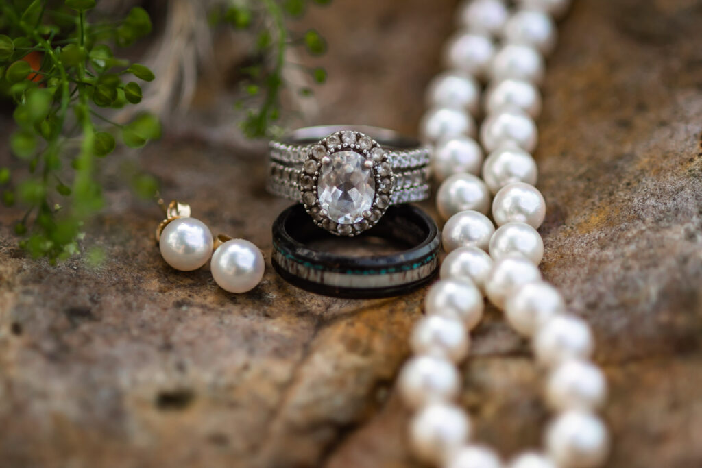 Atlanta wedding photographer photographs the Bride & Groom's wedding rings and her jewelry as part of their wedding details. 